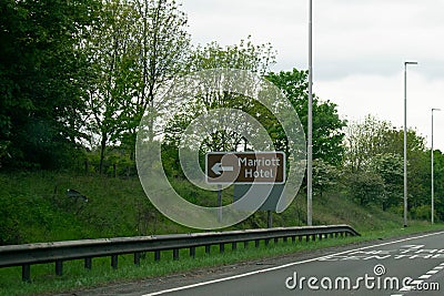 Brown motorway sign to the Marriott Hotel near the Metro Centre in Newcastle, Tyne and Wear Editorial Stock Photo