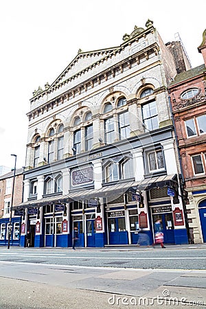 Newcastle Tyne Theatre building exterior with traffic moving past Editorial Stock Photo