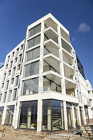 Newly build still under construction white building against dark blue sky Stock Photo