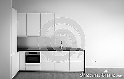 Newly built kitchen in empty living room Stock Photo