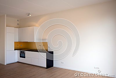 Newly built kitchen in empty living room Stock Photo