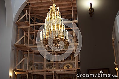 A newly constructed building of the church scaffolding cladding domes chandelier Stock Photo