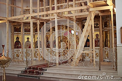 A newly constructed building of the church scaffolding cladding domes chandelier Stock Photo