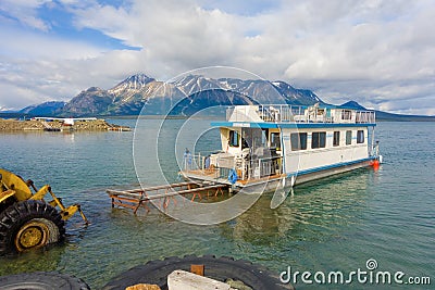 A newly launched houseboat on a lake in northern bc Editorial Stock Photo