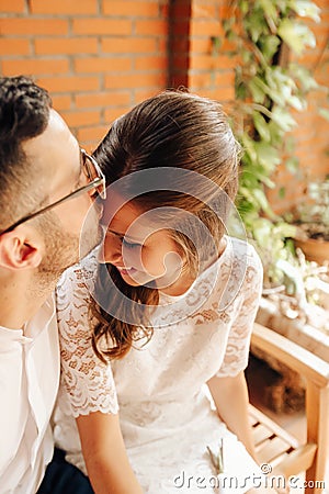 Newly married couple caressing and kissing on their wedding day. Love concept Stock Photo