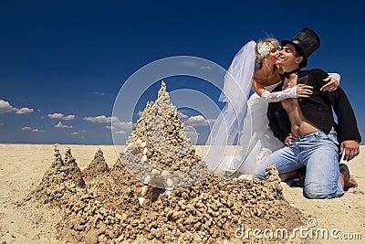 Newly-married couple enjoying on the beach Stock Photo