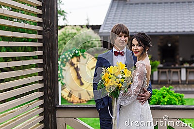 Newly married ready to enter in luxurious wooden mansion Stock Photo