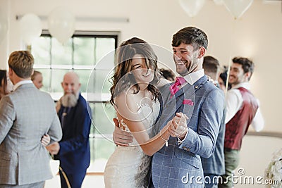 Newly Wed Couple Dancing With Their Guests Stock Photo