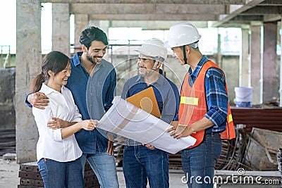 Newly wed couple is meeting with engineering contractor at their under construction house to inspect the building progress and Stock Photo