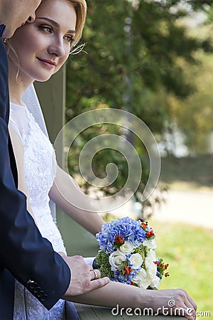 Newly weds holding hands Stock Photo