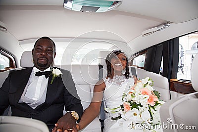 Newlywed african couple sitting in the car Stock Photo