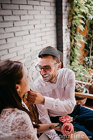 Newlywed couple caressing and looking at each other and smiling on their wedding day. Love concept Stock Photo