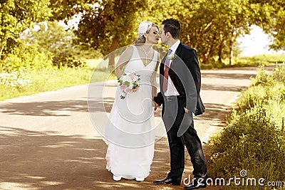 Newlywed couple kissing Stock Photo