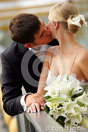 Newlywed couple kissing Stock Photo