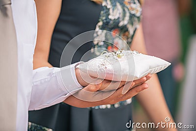 Newlyweds exchange rings, groom hold bride`s hand. Stock Photo