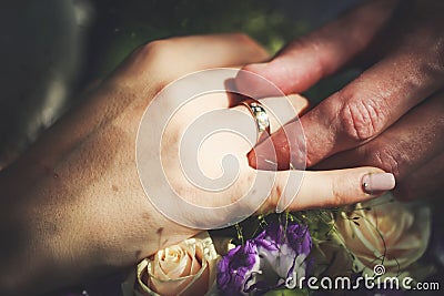 Newlyweds exchange rings Stock Photo