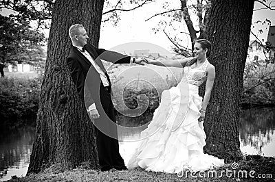 Newlyweds hold hands Stock Photo