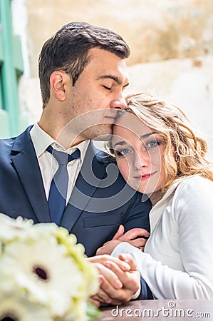 Newlyweds sitting in the Cafe Stock Photo