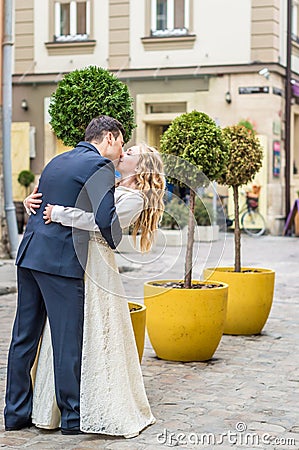 Newlyweds strolling around the city Stock Photo