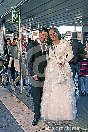 Newlyweds in Venice at the water bus stop Editorial Stock Photo