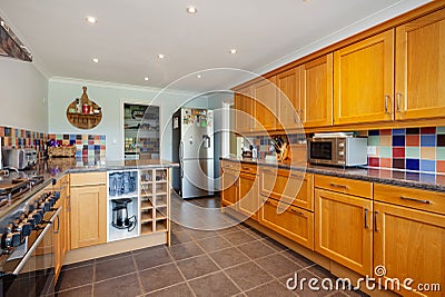 Fitted kitchen with freestanding refrigerator Editorial Stock Photo