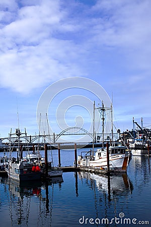 Newport bay bridge and docked fishing boats. Editorial Stock Photo