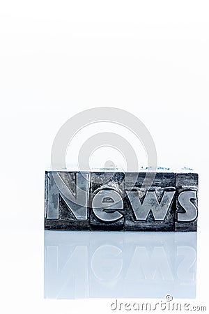 News in lead letters Stock Photo