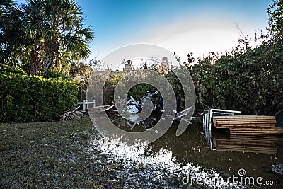 NEWS â€“ Submerged in floodwaters and mud from Hurricane Ian are a skidoo and an ATV near Vanderbilt Beach, Naples Editorial Stock Photo