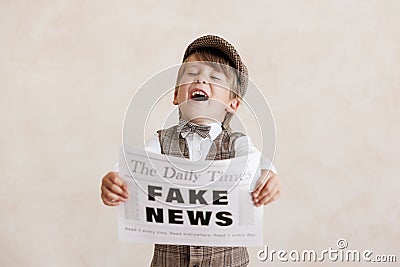 Newsboy shouting against grunge wall background. Boy selling fake news Stock Photo