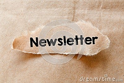 Newsletter text written on a small piece of paper. High resolution photo, top view. Stock Photo