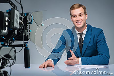 Newsman during shooting process Stock Photo