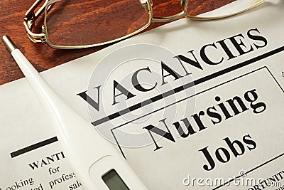 Newspaper with ads nursing jobs vacancy. Stock Photo