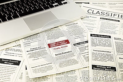 Newspaper with advertisements and classifieds ads Stock Photo
