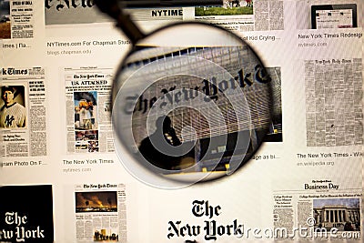 Newspaper title close up view under magnifying glass on computer screen. Beautiful backgrounds. Editorial Stock Photo