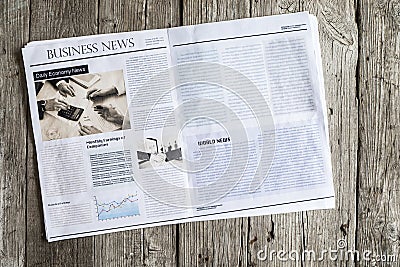 Newspaper on wooden table Stock Photo