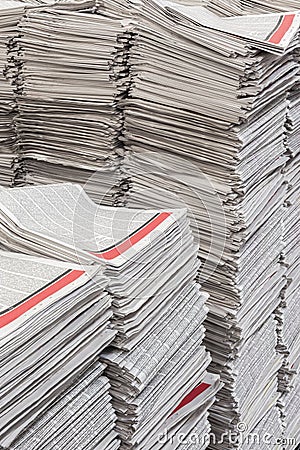 Newspapers in tall stacks Stock Photo