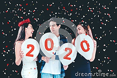 Newyear party ,celebration party group of asian young people holding balloon numbers 2019 happy and funny concept Stock Photo