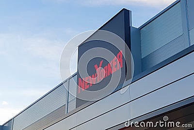 NewYorker store logo on clear blue sky Editorial Stock Photo