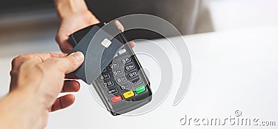 nfc contactless payment by credit card and pos terminal Stock Photo