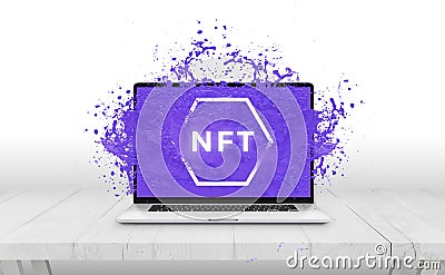 NFT non-fungible token text comes out with purple liquid from laptop display concept Stock Photo