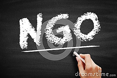 NGO - Non-Governmental Organization is an organization that generally is formed independent from government, acronym text concept Stock Photo