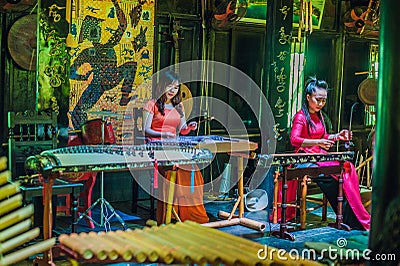 Nha Trang , VIETNAM - January 7, 2017: Vietnamese women musicians playing folk instruments Editorial Stock Photo