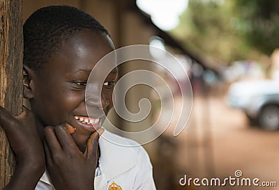 Portrait of a young african boy at the entrance of his home in the town of Nhacra in Guinea Bissau Editorial Stock Photo