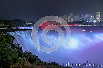Niagara Falls lit at night by colorful lights Editorial Stock Photo