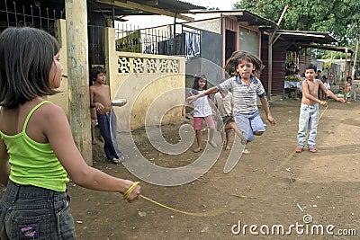 Nicaraguan children while jumping rope on street Editorial Stock Photo