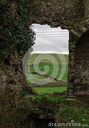 Nice aerial view of an old rural cemetery from the ruins of a stone building. Irish landscape Stock Photo