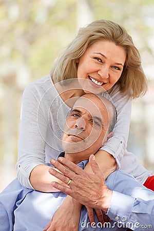 Nice aged couple hugging each other Stock Photo