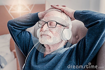 Nice aged man closing his eyes Stock Photo