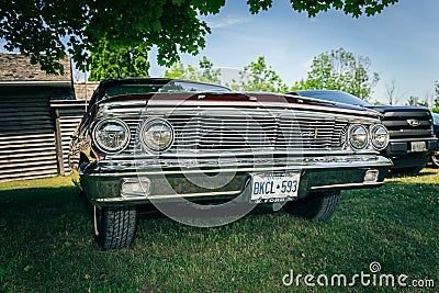 nice amazing front view of classic vintage retro car standing in park Editorial Stock Photo