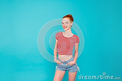 Nice attractive positive skinny cheerful red-haired girl with bu Stock Photo